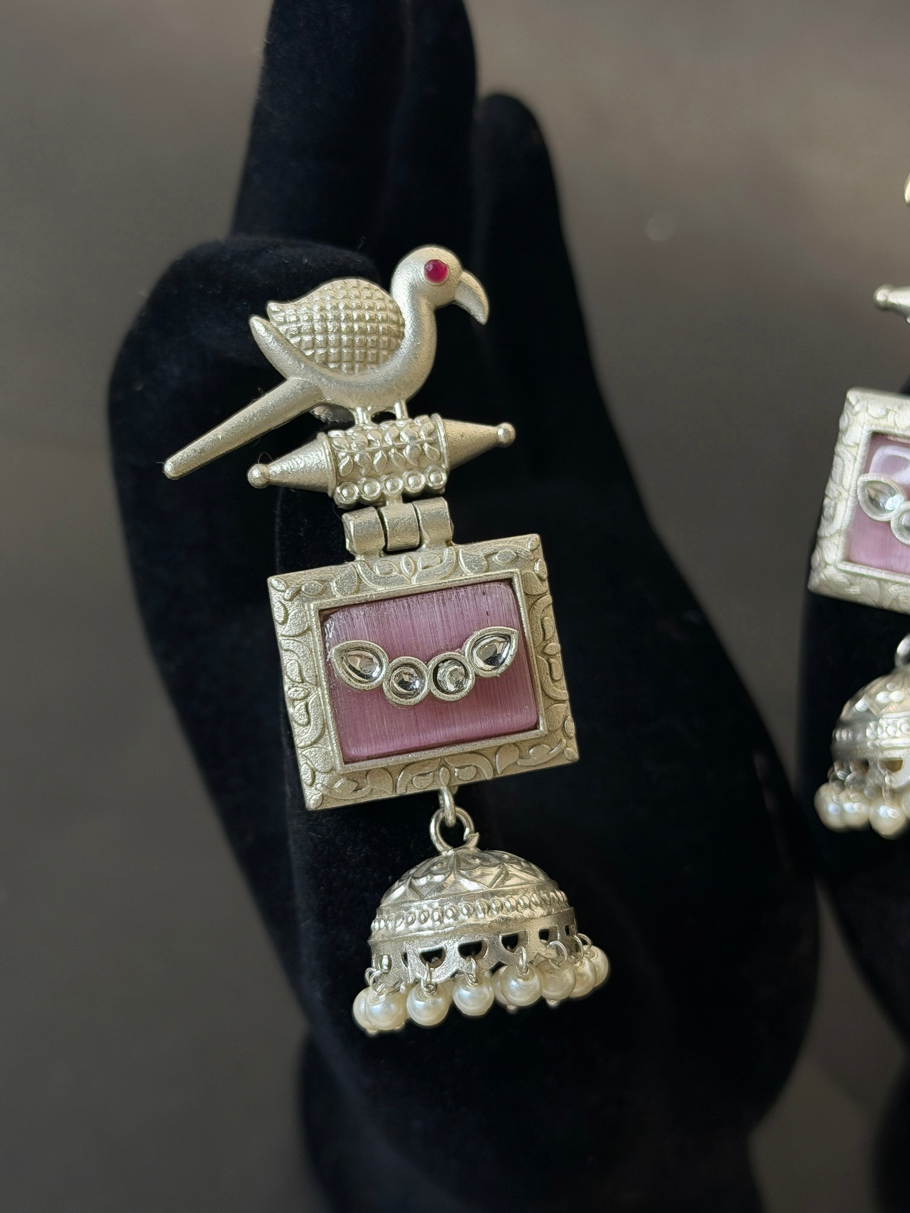 Silver earring with pink gemstone