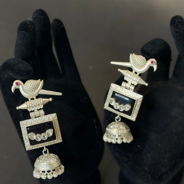 Pair of silver earrings with bird design 