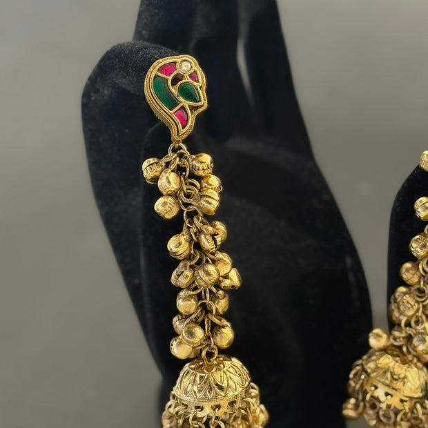 Gold earrings with intricate designs